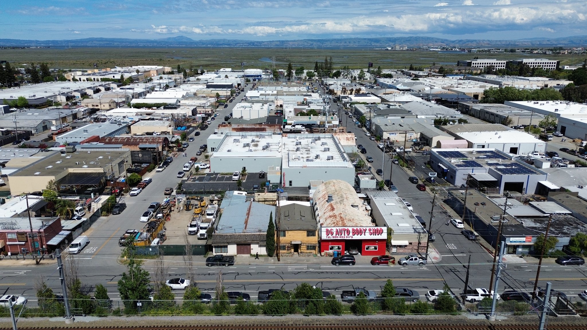 Wide aerial view of San Carlos property and neighborhood